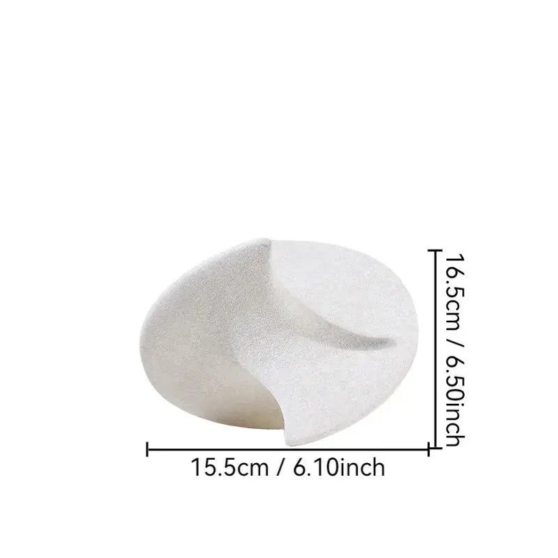 A minimalist white ceramic gyroscope ornament with smooth curves and subtle texture for living room decor