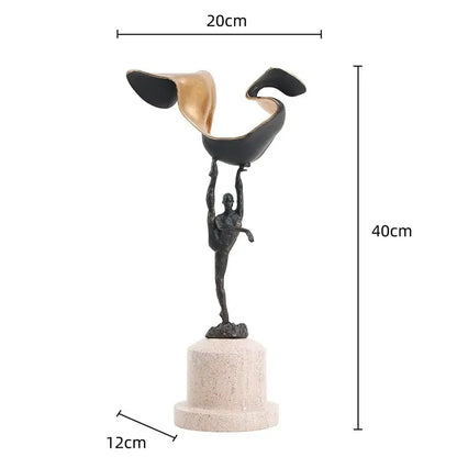 A sleek black and gold metal handicraft figure of a gymnast balancing on one leg for living room decorbites gymnast metal decor
