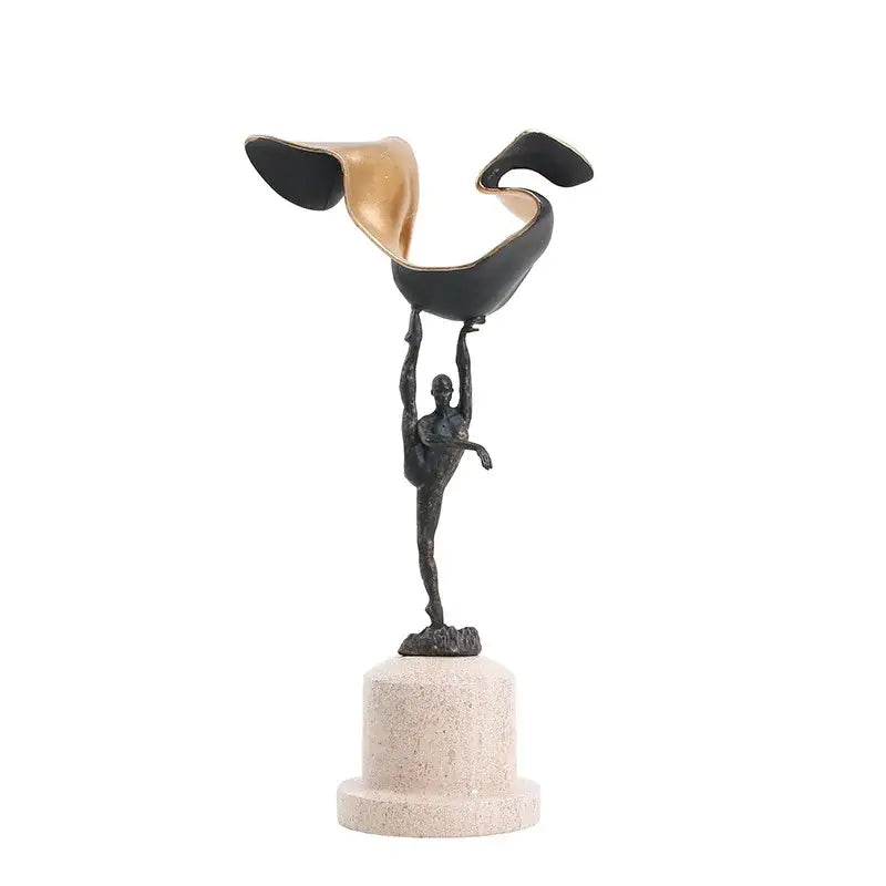 Abstract black and gold gymnast metal handicraft figure balancing on one leg on beige marble base for living room decor