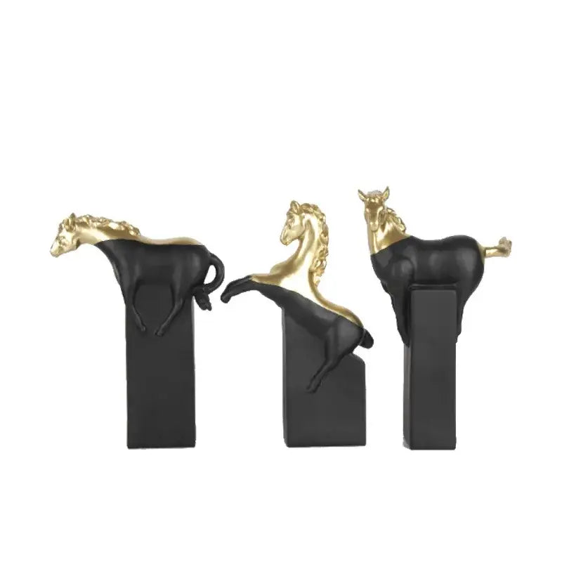 Three black and gold resin decorbites horse statues on sleek rectangular bases for elegant living room decor