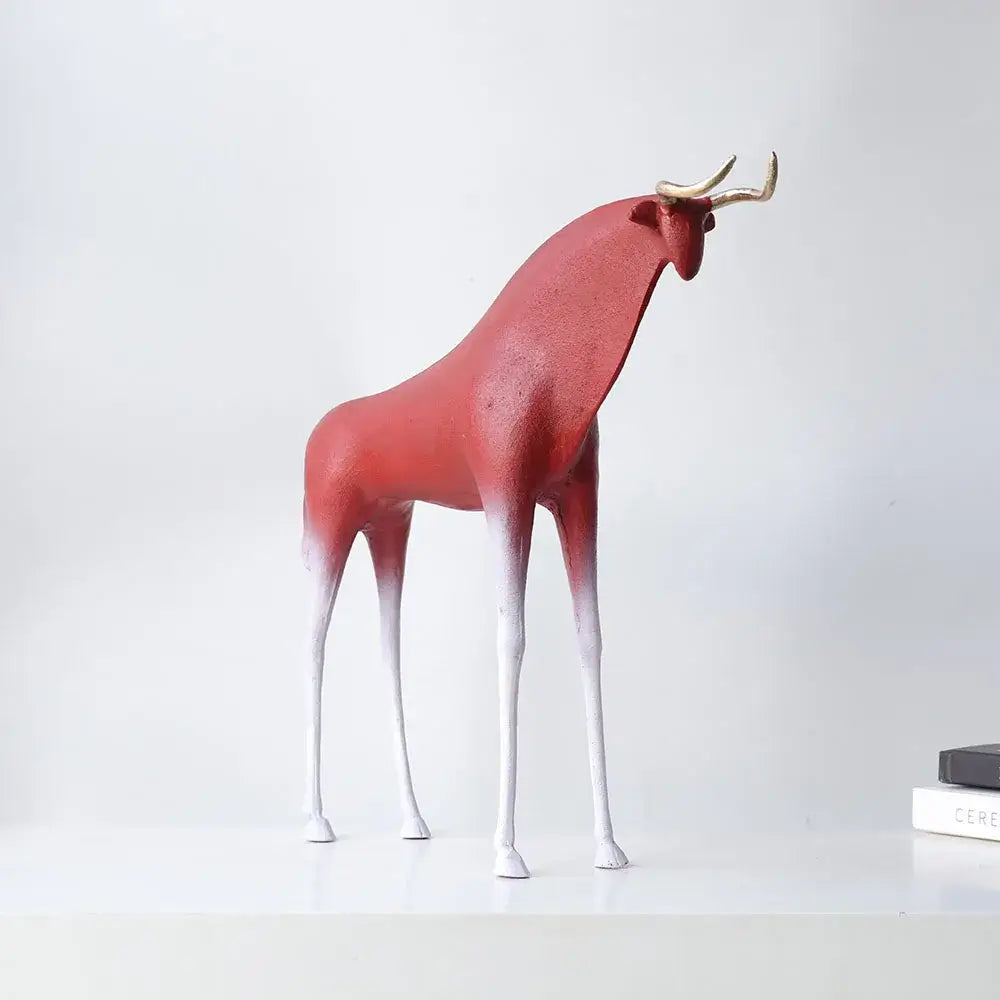 A sleek modern red and white iron horse figurine with golden horns for living room bull decor