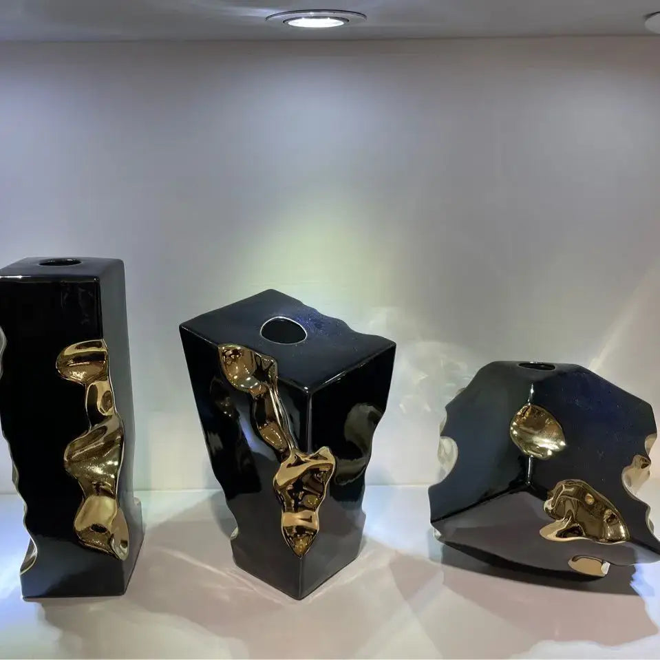 Three sleek black ceramic notch vases with golden flowing accents for modern living room decorbites golden notch accessory