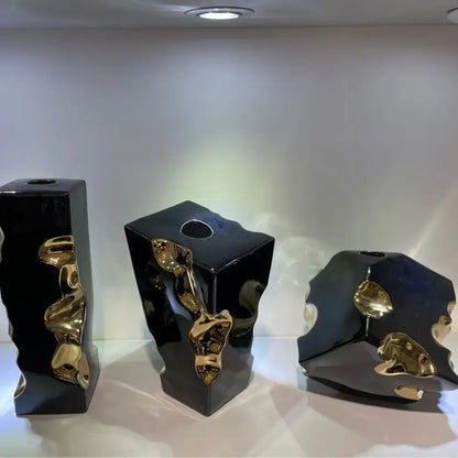 Three sleek black ceramic notch vases with golden flowing accents for modern living room decorbites golden notch accessory