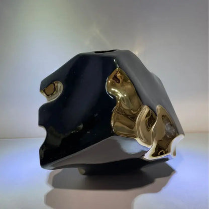 Abstract black and golden notch ceramic vase with gold metallic accents for living room decor by decorbites golden notch