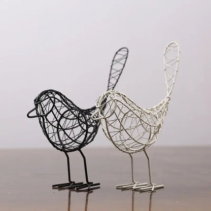 Two abstract black and white wire-woven iron bird figurines with intricate lattice design for living room decorbites iron bird decor