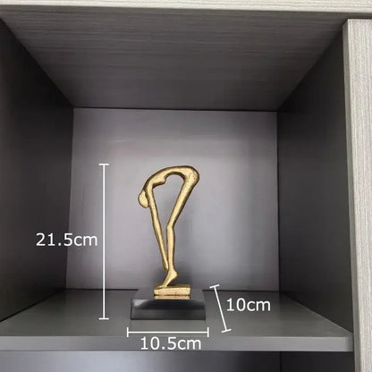 Gold-colored abstract gymnast statue desk ornament with sleek minimalist design and smooth metallic finish for decorbites decorbites gymnast statue