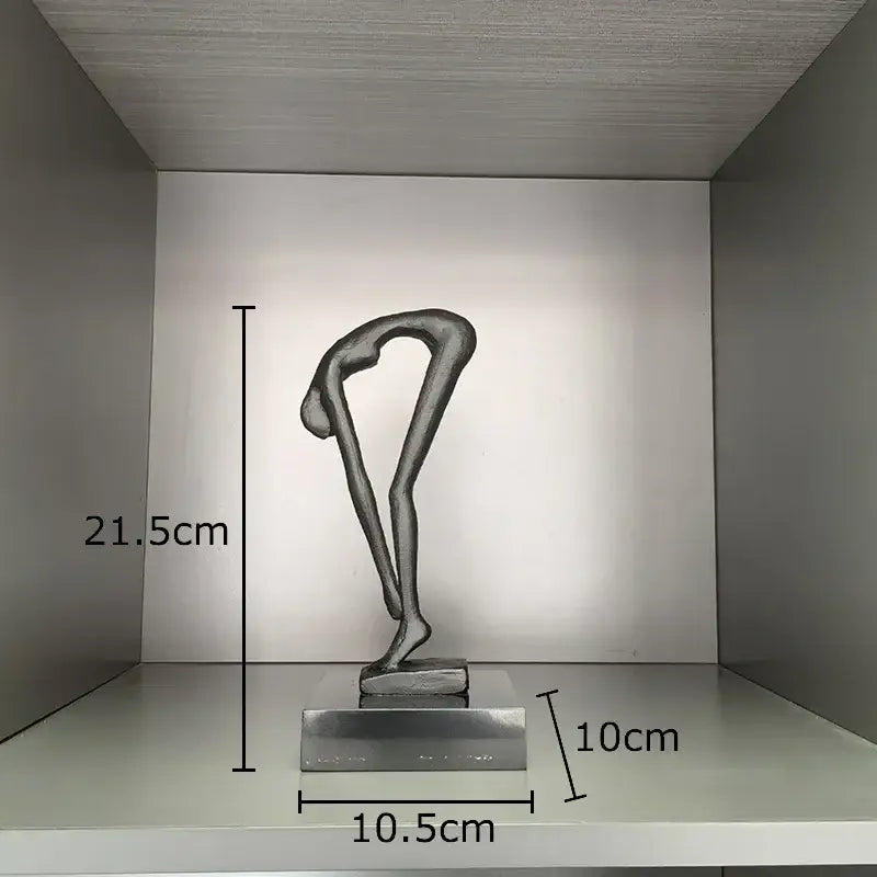 Silver abstract metal gymnast statue desk ornament featuring a bent-over figure on a rectangular base for decorbites decor