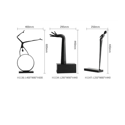 Three minimalist black metal sports figure sculptures on rectangular bases for living room decorbites black metal decor