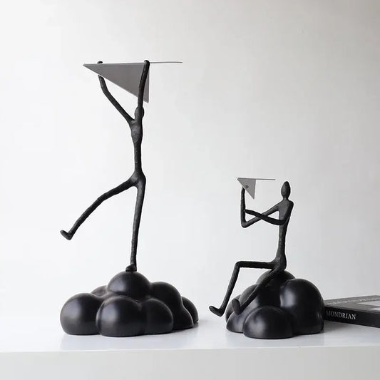 Black metal abstract figurines balancing resin paper airplane clouds for living room decor