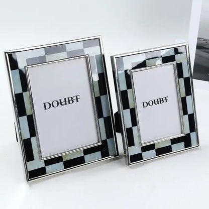 Silver-framed photo frame with black and light blue checkered inlay for bedroom desktop decor featuring decorbites black white design