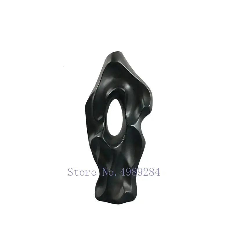 Abstract black resin sculpture with smooth flowing contours and central oval opening for decorbites black ceramic vase decor