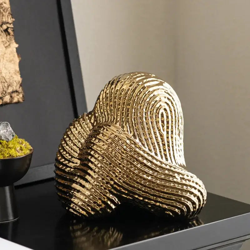 Golden textured abstract geometric stone rockery sculpture with layered wave-like ridges and glossy finish for living room