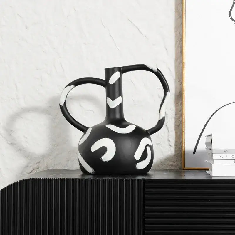 Black ceramic geometric striped vase with bold white abstract handle and dual curved handles for living room decorbites decor