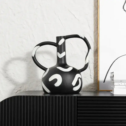Black ceramic geometric striped vase with bold white abstract handle and dual curved handles for living room decorbites decor
