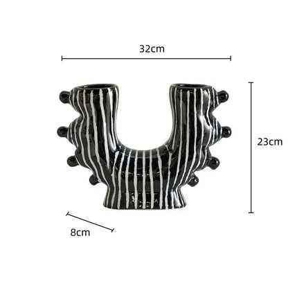 Black ceramic graffiti ceramic vase with white stripes and rounded protrusions for living room decorbites graffiti decor