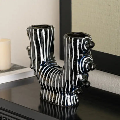 Abstract black and white decorbites graffiti ceramic vase shaped like a stylized dog for living room decor
