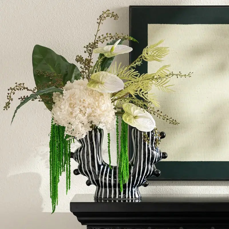 Black and white striped graffiti ceramic vase with sculpted organic form for living room decor by decorbites graffiti ceramic