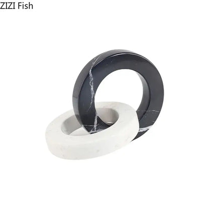 Elegant abstract square ring statue in black and white marble featuring a sleek geometric knot design for living room decor