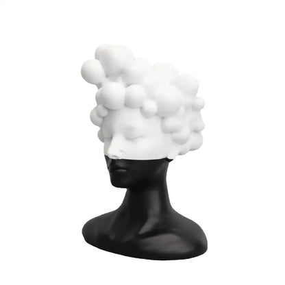 A sleek black and white woman figurine resin sculpture with a glossy finish and abstract bubble hairstyle for decorbites abstract woman decor