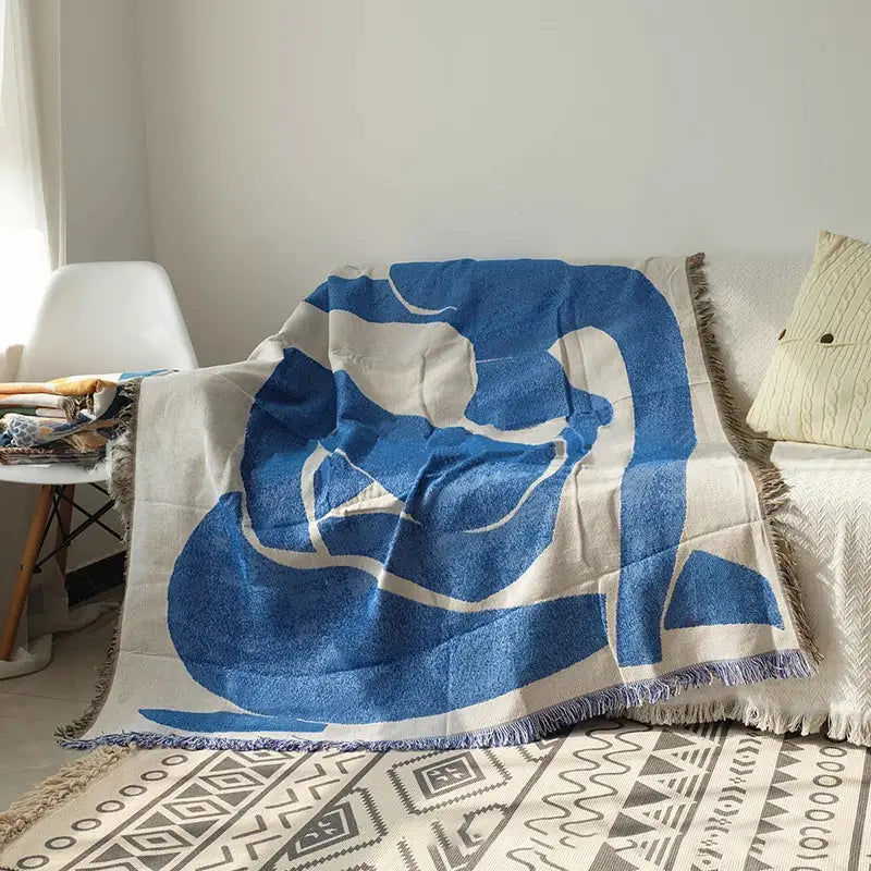 Abstract blue and beige geometric knitted tassels throw blanket with fringed edges ideal for bedroom decor