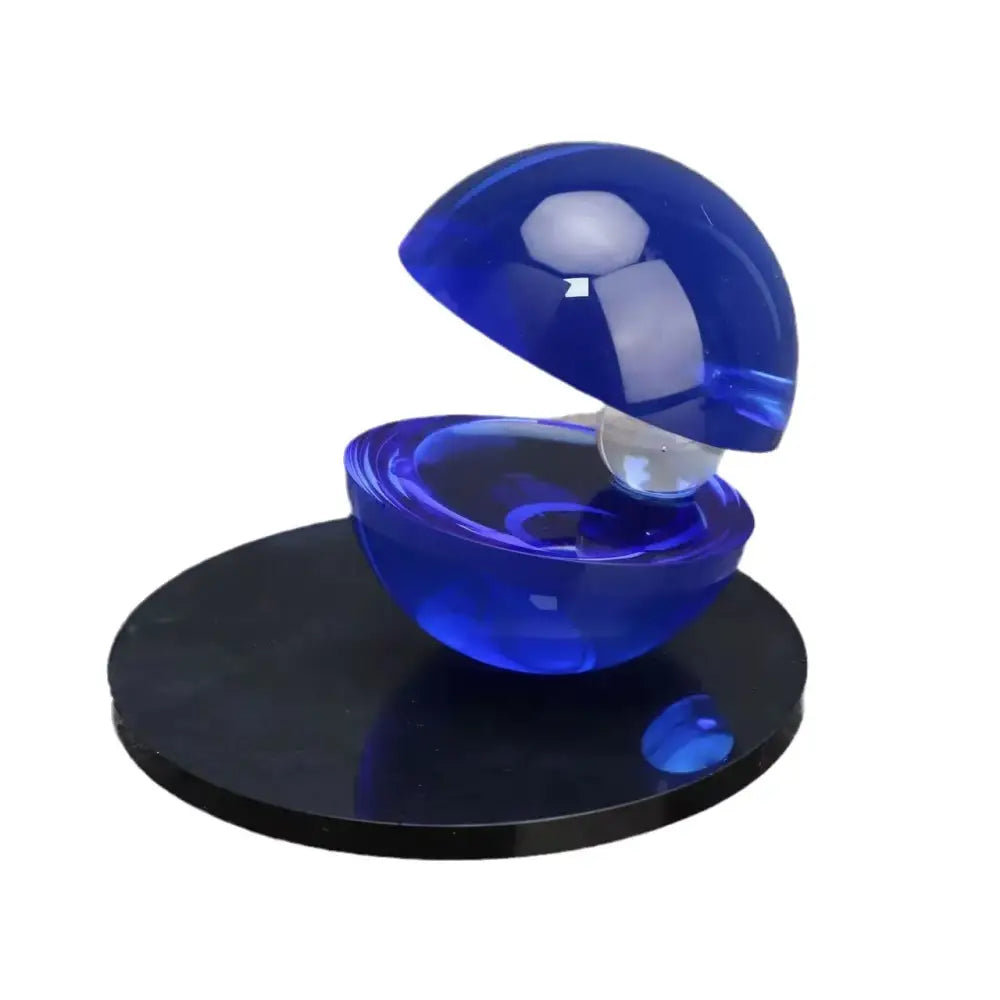 A translucent blue resin orb with hinged lid and embedded sphere for home decor semi-circle ornaments by decorbites crystal glass