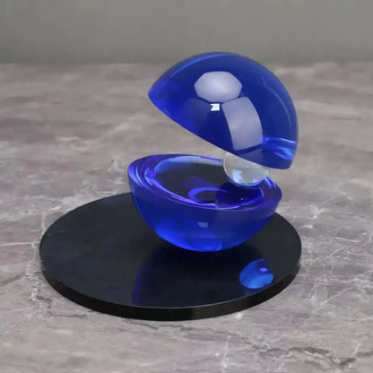 Abstract blue and silver semi-circle ornaments featuring a translucent blue glass orb with an inner clear sphere for home decor by decorbites crystal glass