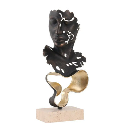 Abstract bronze and gold geometric abstract face sculpture with cut-out details on a stone base for living room display