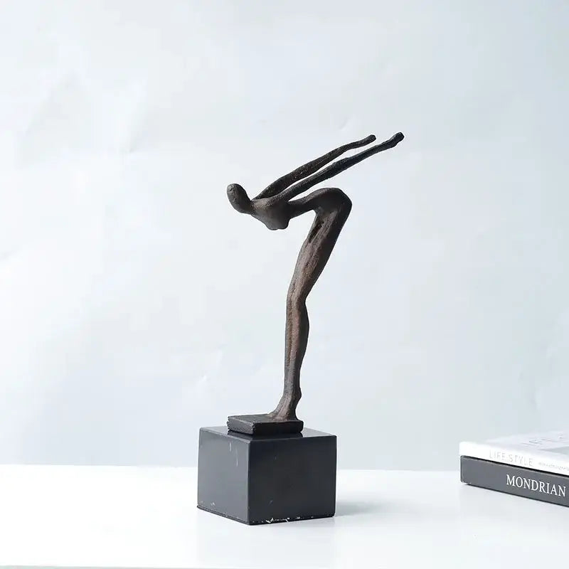 Abstract bronze diving sportsman metal sculpture in mid-air pose on black square base for living room decor
