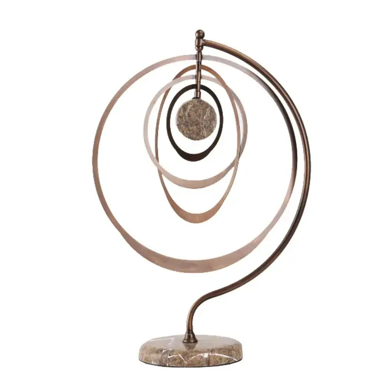 Abstract bronze geometric sphere pendant sculpture with concentric rings and textured disc on marble base for living room decor
