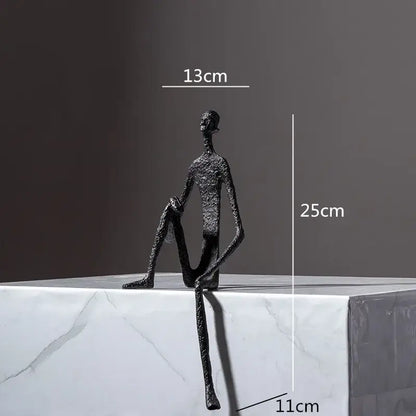 Black textured abstract metal human sculpture with elongated limbs for living room decorbites abstract metal decor