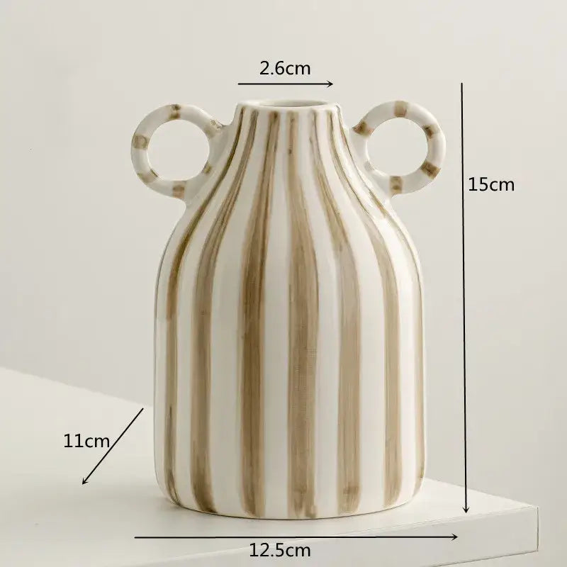 A white ceramic hydroponic vase with beige vertical stripes and double ear handles measuring 15cm tall