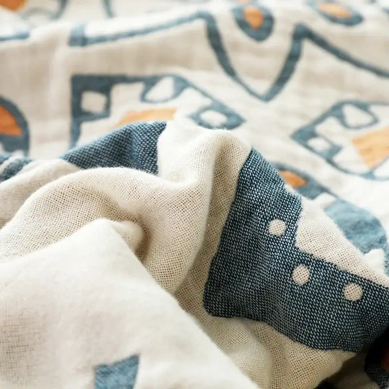 Abstract cream and blue cotton nordic throw blanket featuring a playful pattern for bedroom decorbites cotton nordic decor