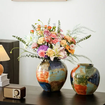 Vibrant decorbites ceramic vase with glossy finish hand-painted floral design and color stitching in earthy tones for living room decor