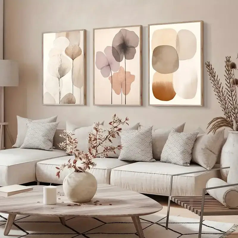 Cream-colored ceramic vase with a rounded textured surface displayed alongside decorbites™ abstract beige canvas wall art
