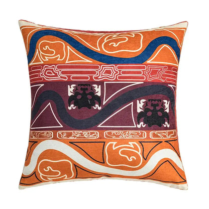 Vibrant orange and maroon cushion cover with bold geometric and stylized animal motifs for decorbites abstract geometric decor