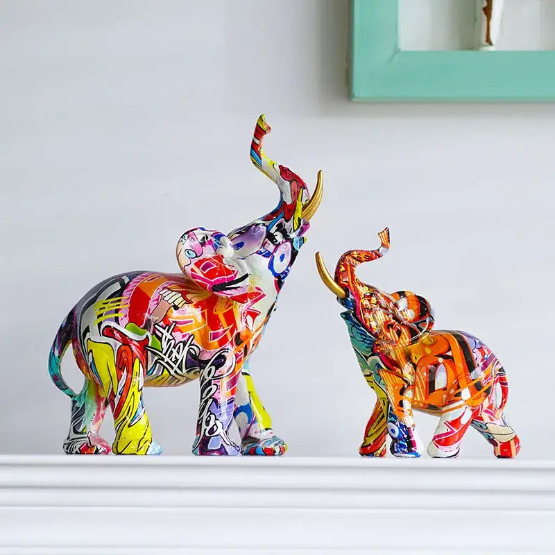 Two vibrantly painted abstract geometric elephant resin art statues with gold trimmed tusks for living room decorbites elephant resin decor