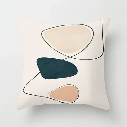 Cream-colored pillow cover with decorbites geometric stitch print featuring abstract shapes in beige teal and dusty rose tones
