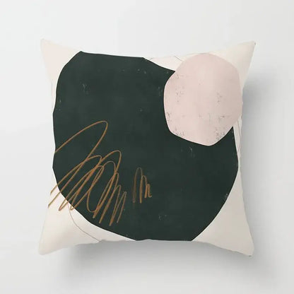 Cream-colored pillow cover with decorbites geometric stitch featuring black shape pink circle and gold brushstroke accents