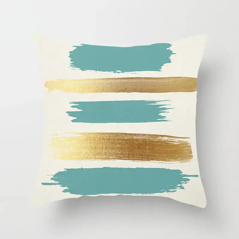 Cream-colored pillow cover with bold teal and metallic gold brushstroke patterns for decorbites geometric stitch print decor