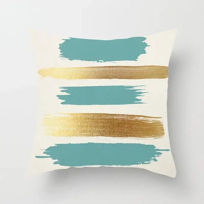 Cream-colored pillow cover with bold teal and metallic gold brushstroke patterns for decorbites geometric stitch print decor