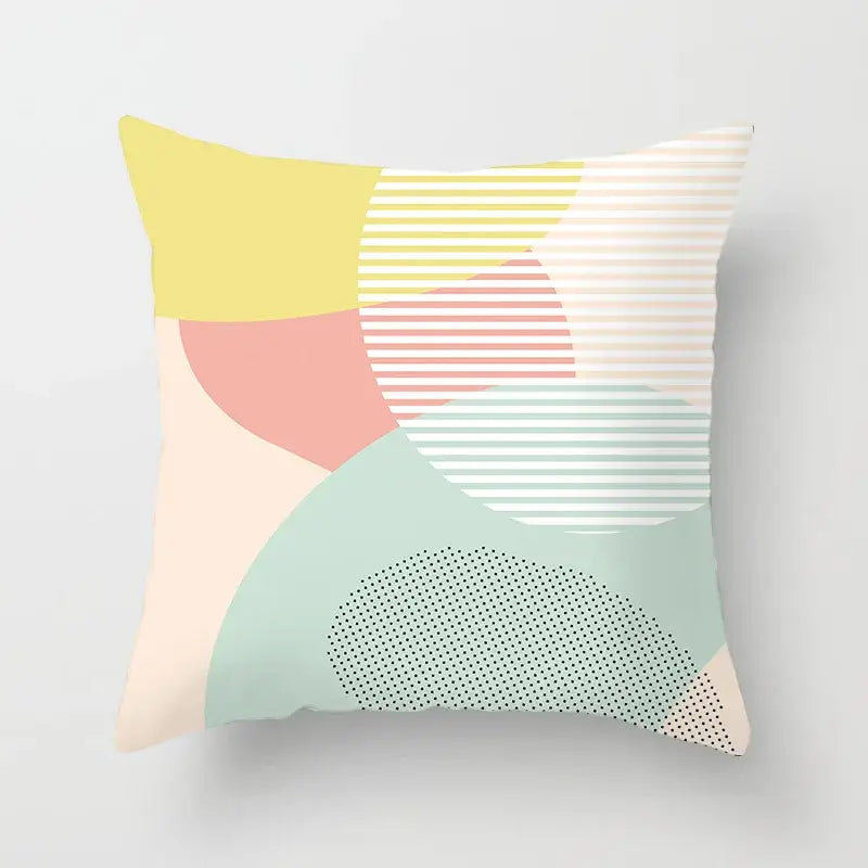 Pastel-colored abstract geometric stitch print pillow cover with yellow pink mint green cream decorbites geometric stitch patterns
