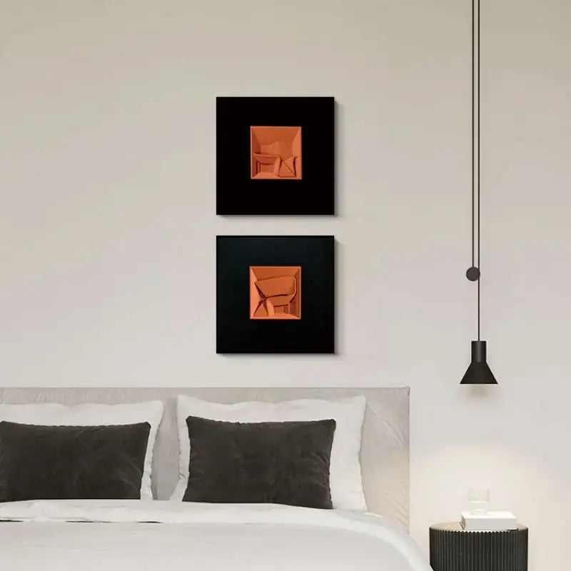 Two square black-framed abstract geometric wall decoration pieces featuring raised orange shapes for living room decorbites abstract geometric art