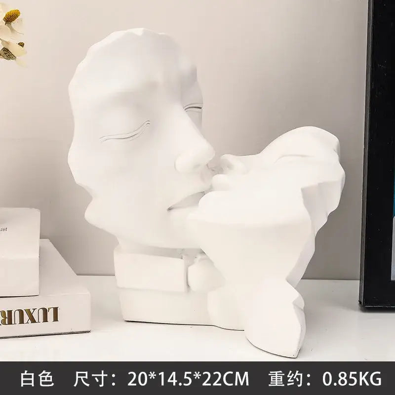 White resin abstract gold head couple sculpture featuring two faces in a tender embrace for living room decorbites decor