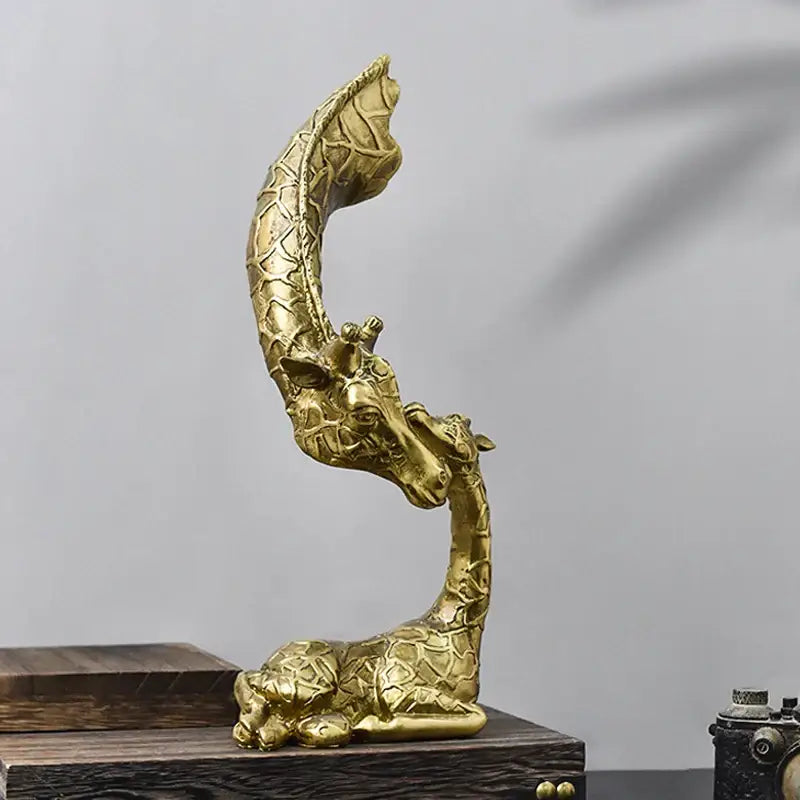 Golden abstract resin giraffe figurine with intricate patterned texture and curved neck for decorbites living room decor