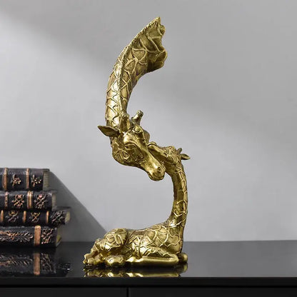 Golden abstract resin giraffe figurine with intricate textured pattern and curved neck for living room decorbites decor