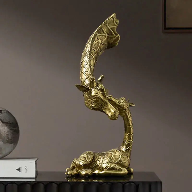 Golden abstract resin giraffe figurine with intricate textured pattern and elegant curved neck for living room decorbites decor