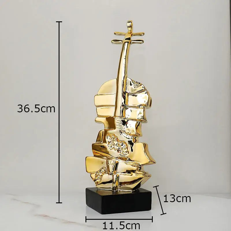 Golden violin sculpture with glossy finish and black base decorbites golden violin for living room table decor