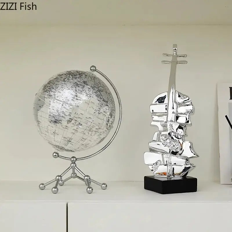 Silver globe desk ornament with detailed world map on metallic stand perfect with decorbites golden violin sculpture decor
