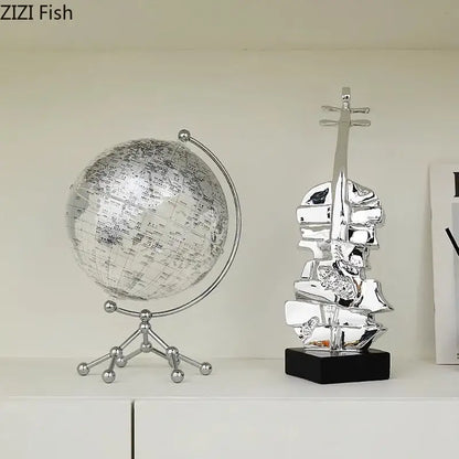 Silver globe desk ornament with detailed world map on metallic stand perfect with decorbites golden violin sculpture decor