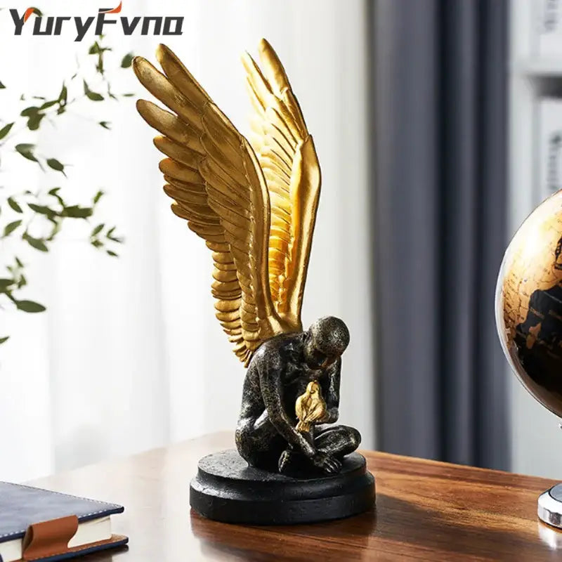 Abstract golden character winged angel resin statue with dark bronze body holding small golden bird for living room decorbites decor